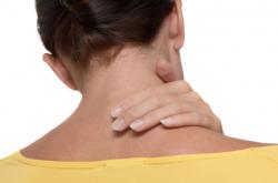 young female suffering from neck pain 